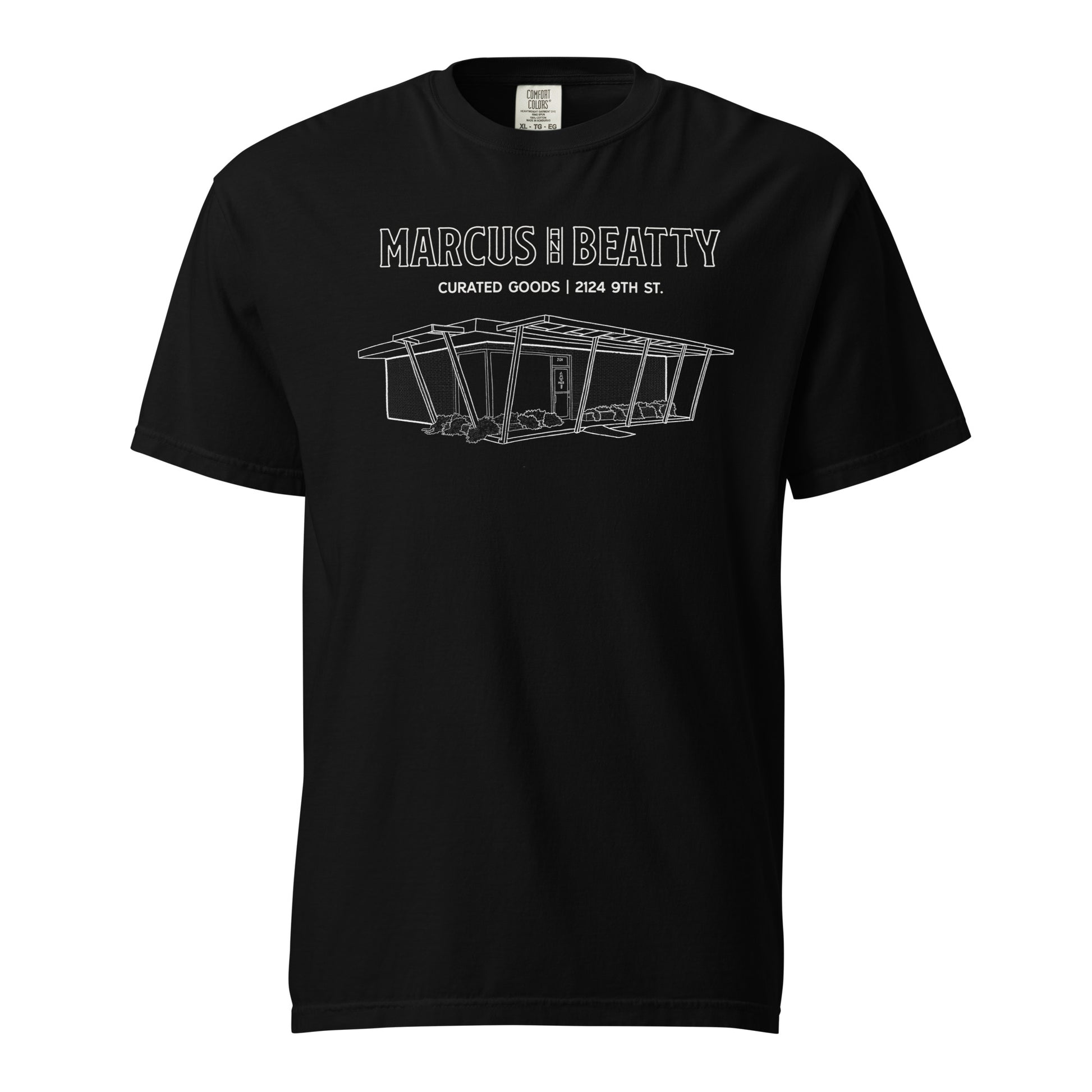 Front View of the Black Marcus & Beatty Mid-Century Storefront Sketch Tee, featuring sketch of storefront design, Comfort Colors garment-dyed cotton, unisex relaxed fit.