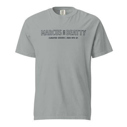 Front View of the Marcus & Beatty Storefront Logo Tee on Comfort Colors garment-dyed cotton, with front logo print inspired by storefront, unisex relaxed fit, Granite color.