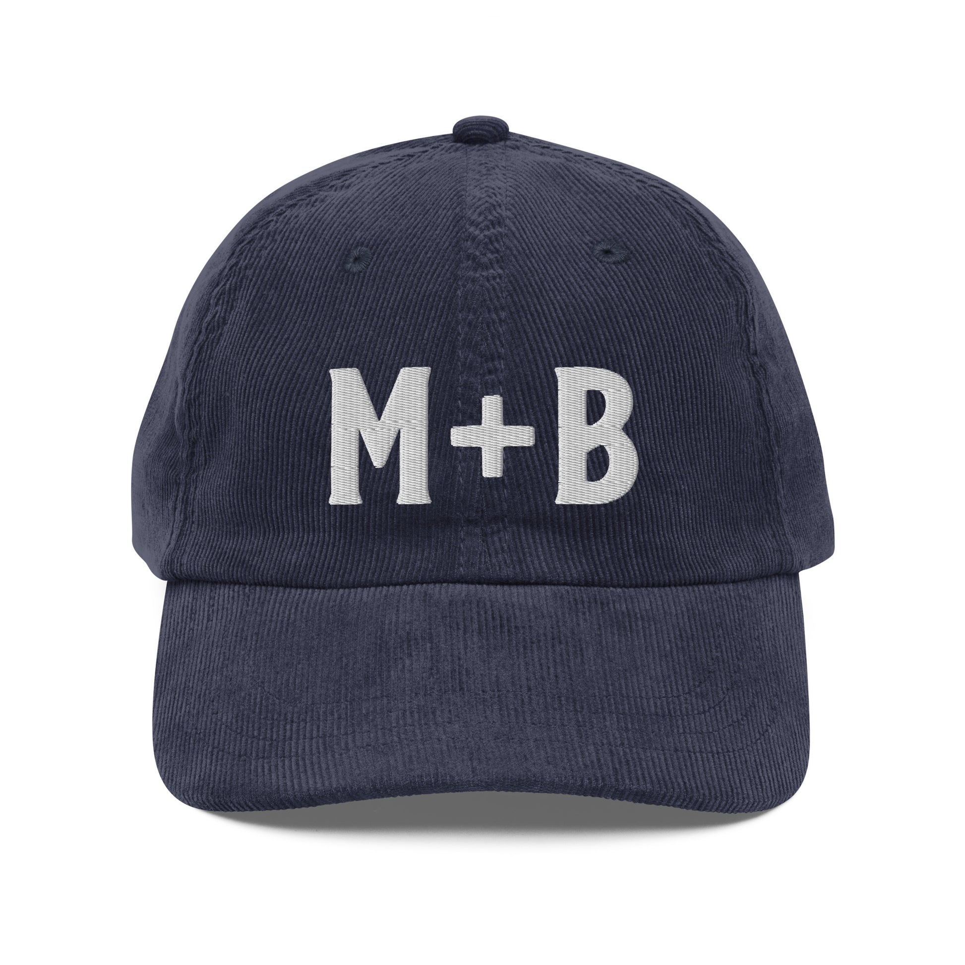 Front View of the Marcus & Beatty navy vintage corduroy cap, embroidered 'M + B' logo in white, adjustable gold buckle strap, unstructured low-profile fit.